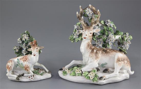 Two Derby porcelain models of recumbent stags, c.1765, 18cm and 11.5cm, some losses and slight restoration